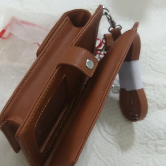 STG hand purse with shoulder strap and slip to put phone. Never used - Picture 9 of 12